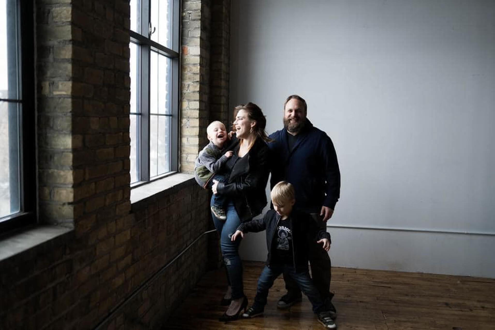 Jessica Strobel posed with her family in a minimal minneapolis photography studio