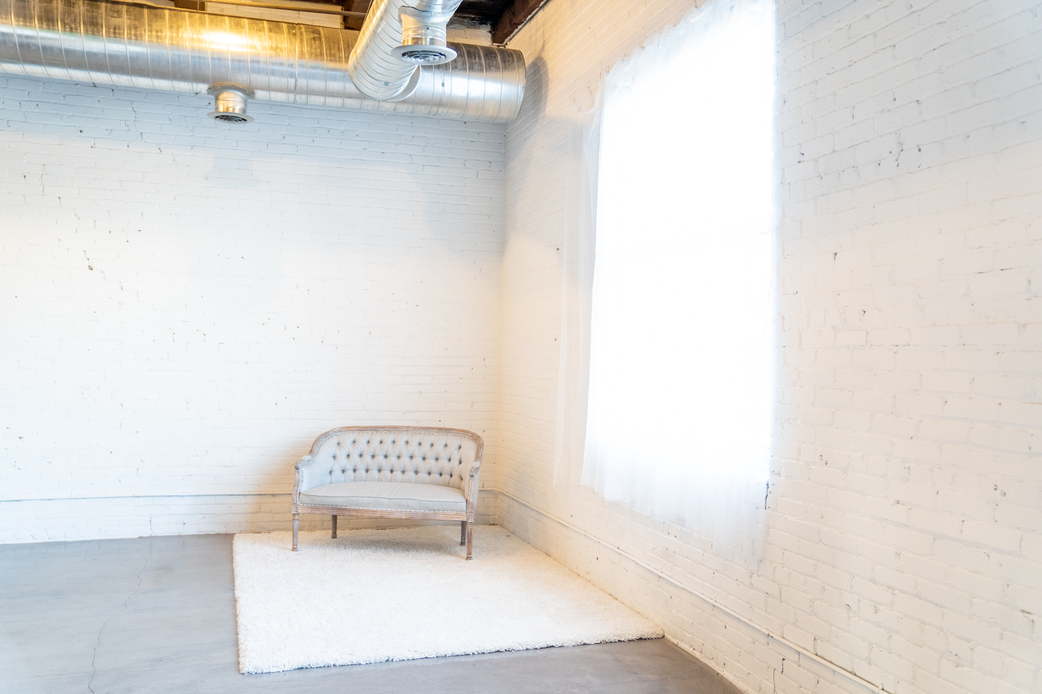 White brick wall setups available in Jessica Strobel's Minneapolis photography studio