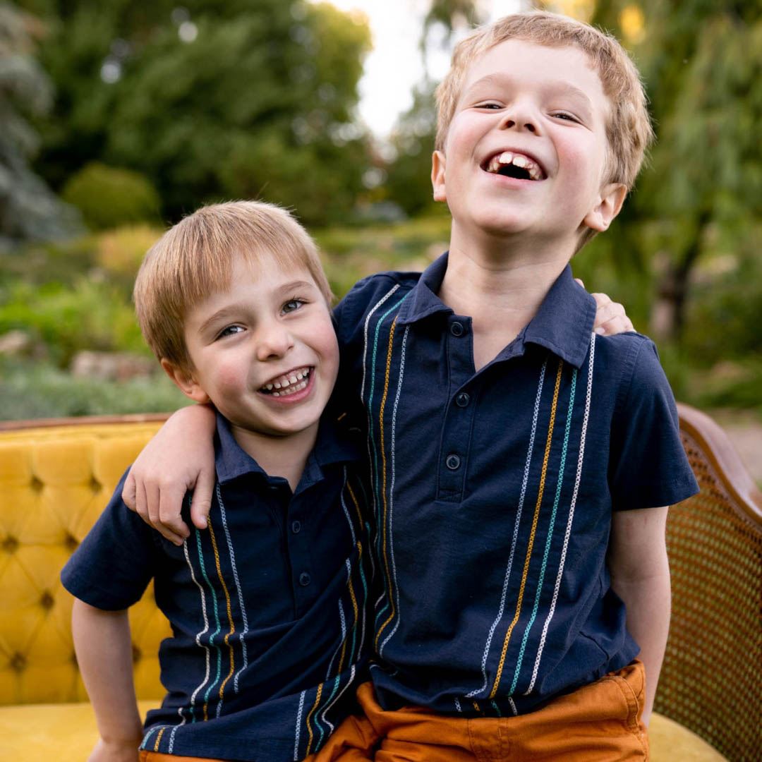 brothers in matching navy polo shirts during Minneapolis Fall Mini Sessions