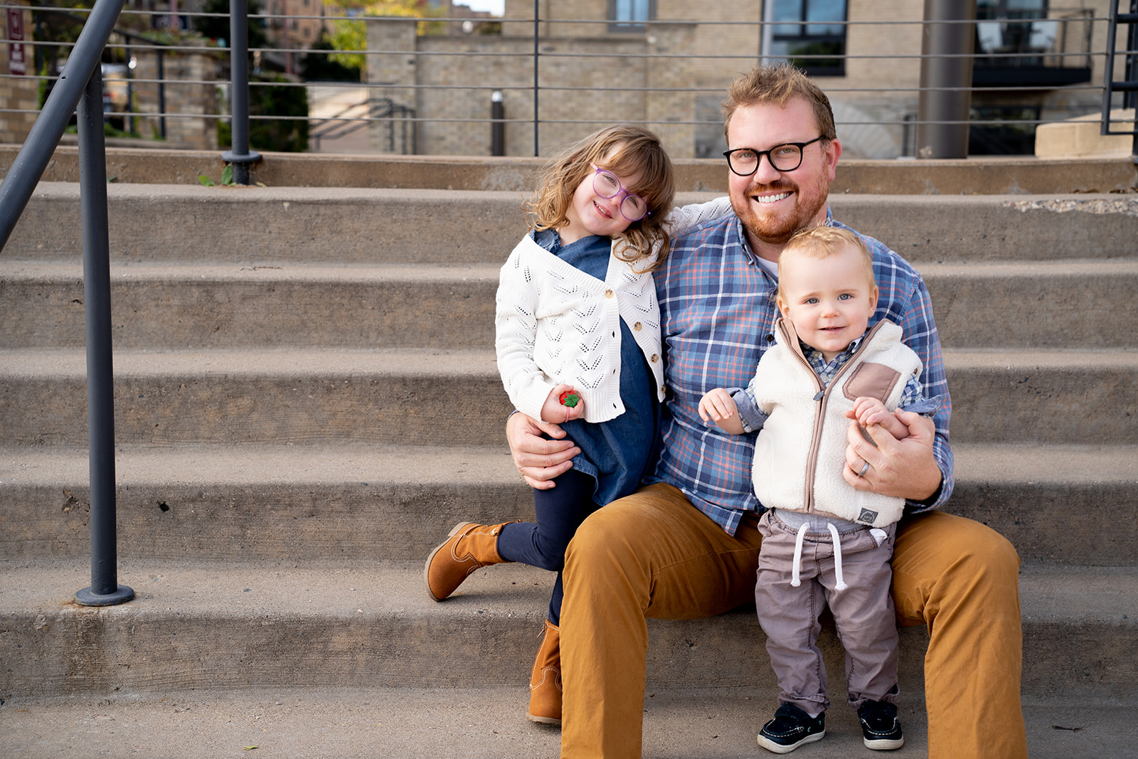 brothers in matching navy polo shirts during Minneapolis Fall Mini Sessions