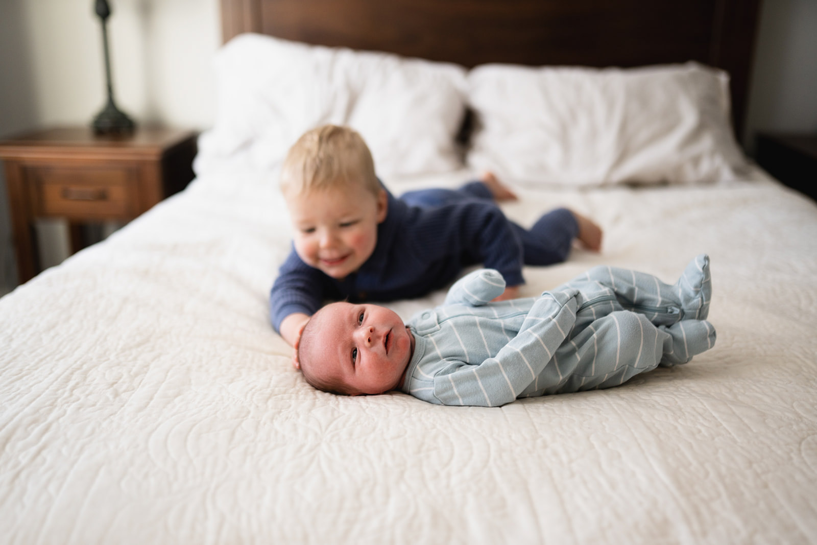 family of six holding hands and walking toward the camera at a golden hour family photo session